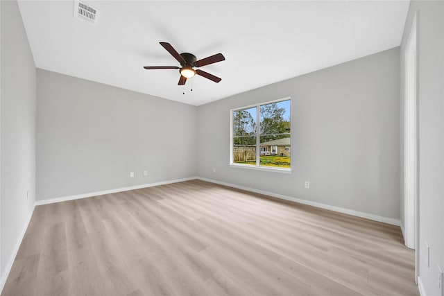 empty room with ceiling fan and light wood-type flooring