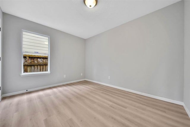 unfurnished room featuring light hardwood / wood-style floors