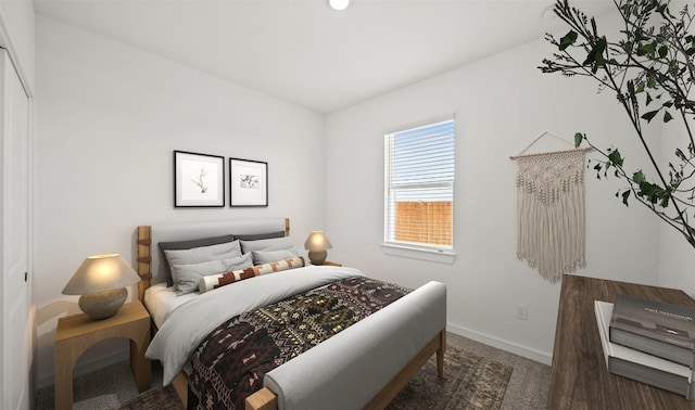 bedroom featuring dark colored carpet