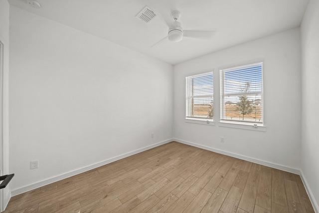 unfurnished room with ceiling fan and light wood-type flooring