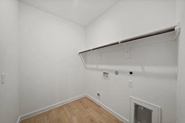 laundry area featuring hookup for a washing machine, gas dryer hookup, hookup for an electric dryer, and light hardwood / wood-style flooring