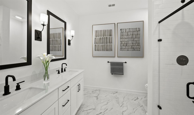 bathroom featuring vanity, toilet, and a shower with shower door