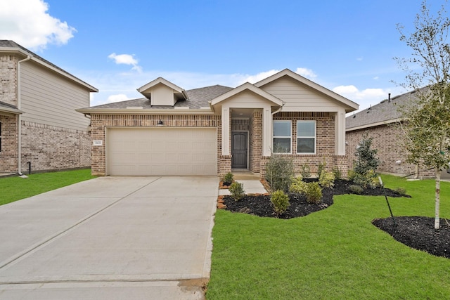 view of front facade with a garage and a front lawn