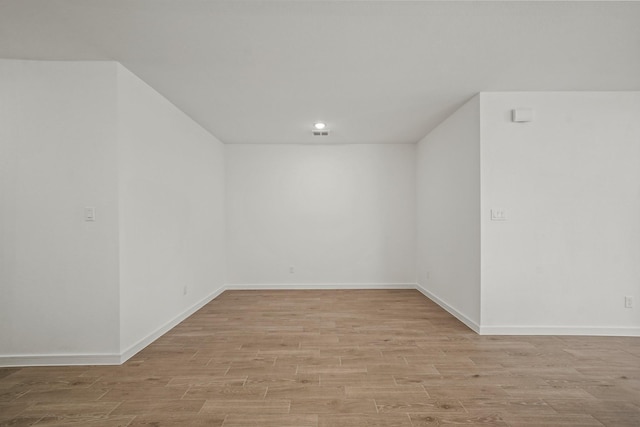 spare room with light hardwood / wood-style floors