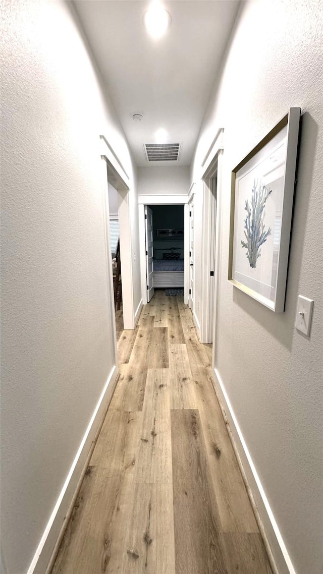 hall featuring light hardwood / wood-style flooring