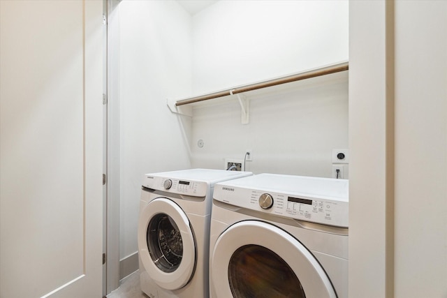 clothes washing area featuring washing machine and dryer