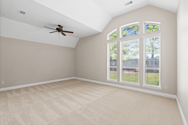 additional living space with vaulted ceiling, light colored carpet, and ceiling fan