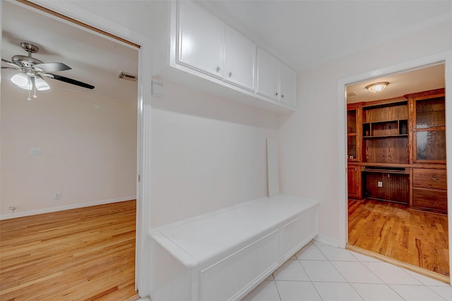 mudroom with light tile patterned flooring and ceiling fan