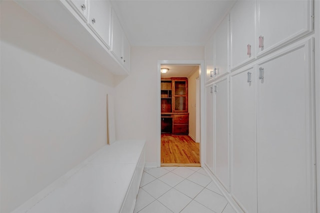 hall with light tile patterned flooring