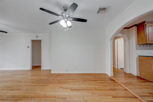 interior space with light hardwood / wood-style flooring, ornamental molding, and ceiling fan