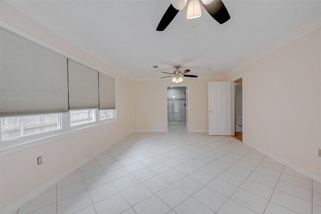 unfurnished room featuring crown molding, ceiling fan, and light tile patterned floors