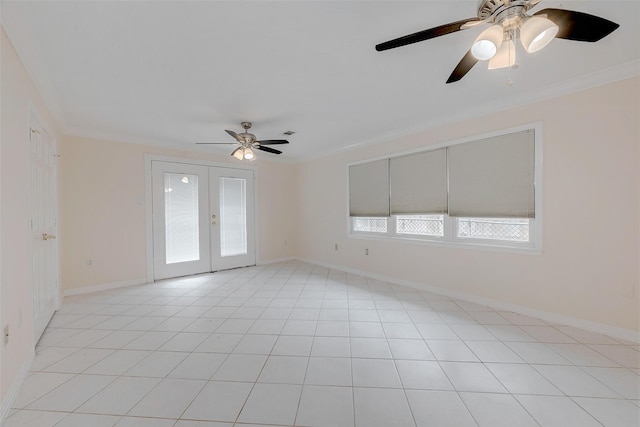 spare room featuring ornamental molding, light tile patterned floors, and french doors