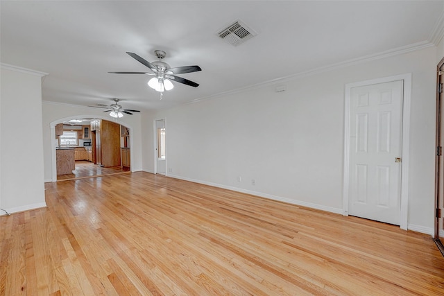 unfurnished living room featuring crown molding, ceiling fan, and light hardwood / wood-style flooring