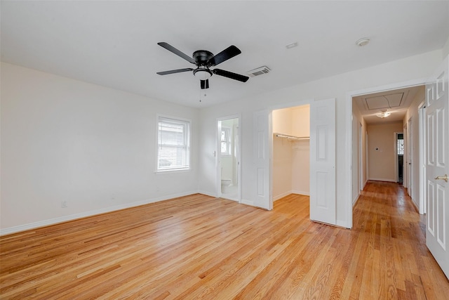 empty room featuring light hardwood / wood-style flooring and ceiling fan