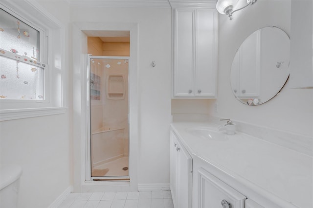 bathroom featuring tile patterned floors, vanity, toilet, and an enclosed shower