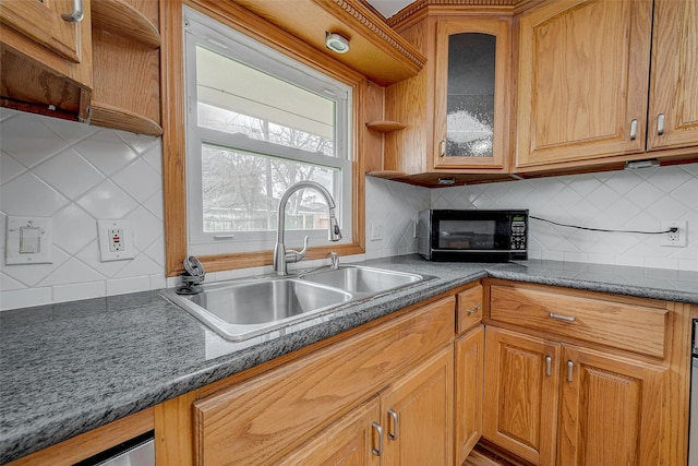 kitchen featuring sink and backsplash