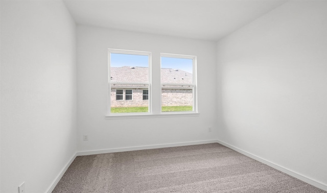 empty room with carpet flooring