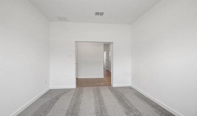 spare room featuring carpet floors