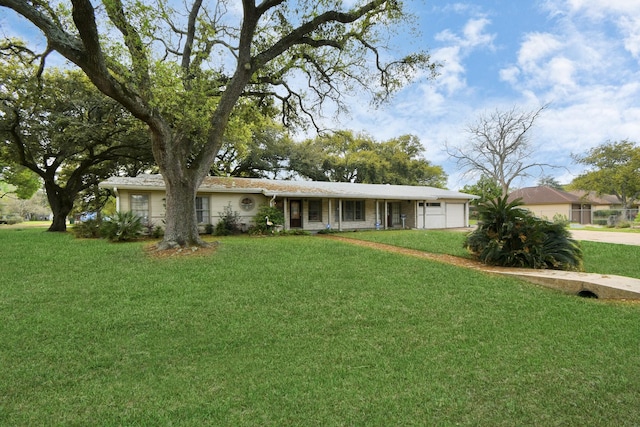 single story home with a garage and a front yard