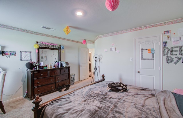 bedroom featuring light carpet