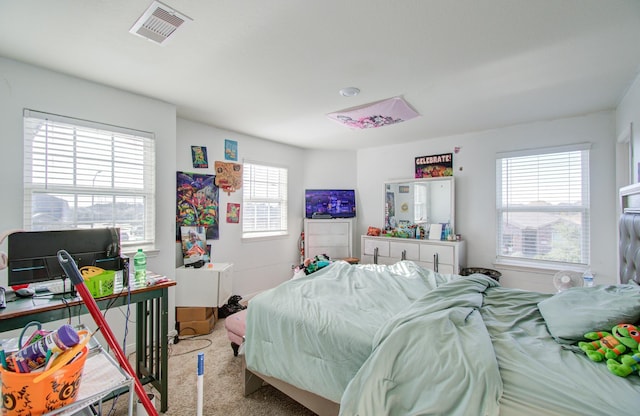 bedroom with light colored carpet