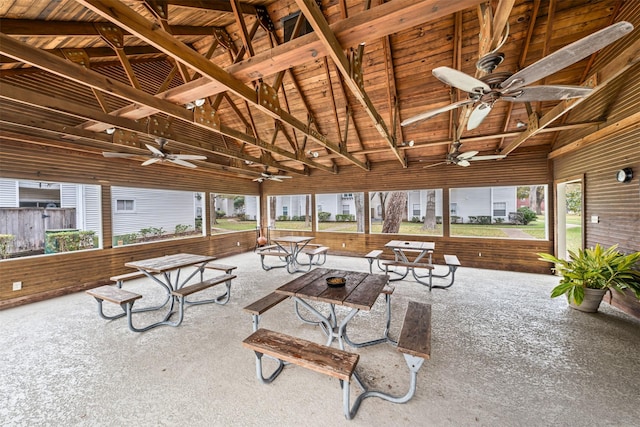 interior space featuring plenty of natural light and vaulted ceiling