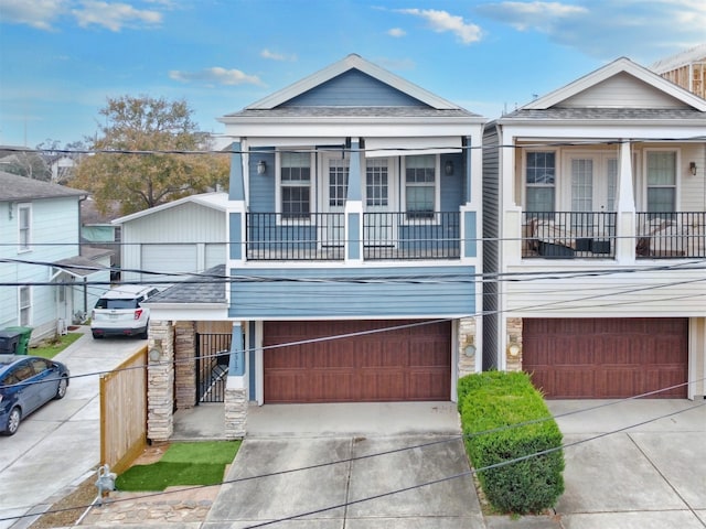 view of front of house with a garage and a balcony