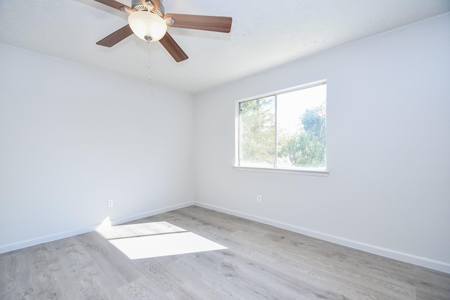 spare room with ceiling fan and light hardwood / wood-style flooring