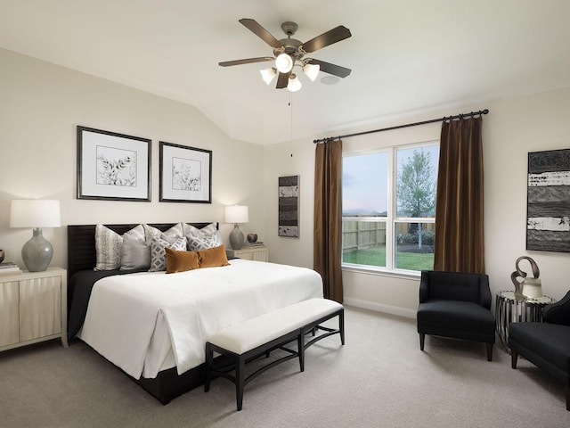 bedroom featuring ceiling fan, light colored carpet, and lofted ceiling