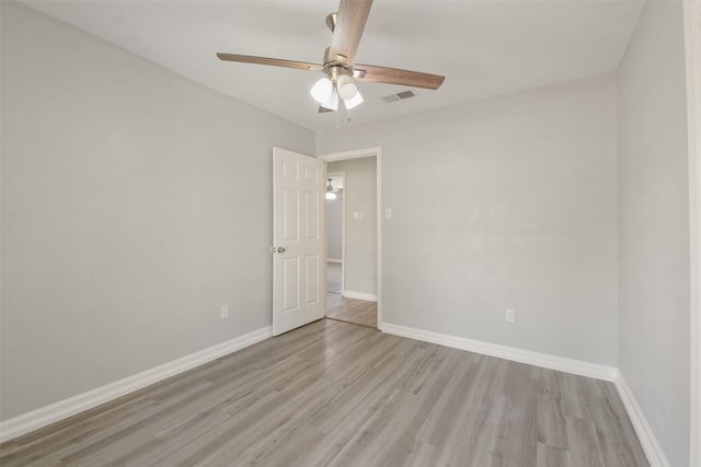 unfurnished room with ceiling fan and light wood-type flooring