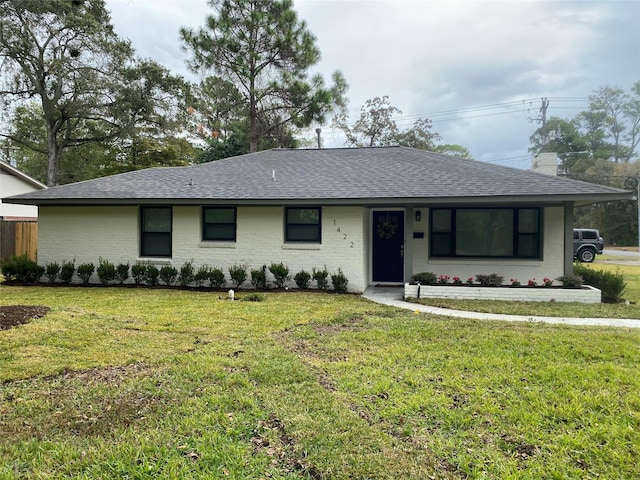 single story home with a front yard