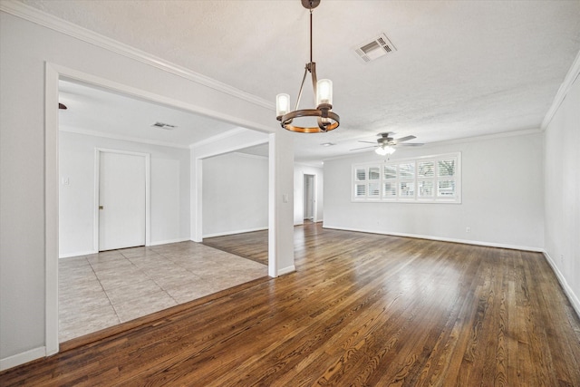 unfurnished room featuring ornamental molding, wood-type flooring, ceiling fan with notable chandelier, and a textured ceiling