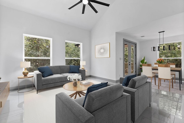 living room featuring a wealth of natural light, high vaulted ceiling, and ceiling fan