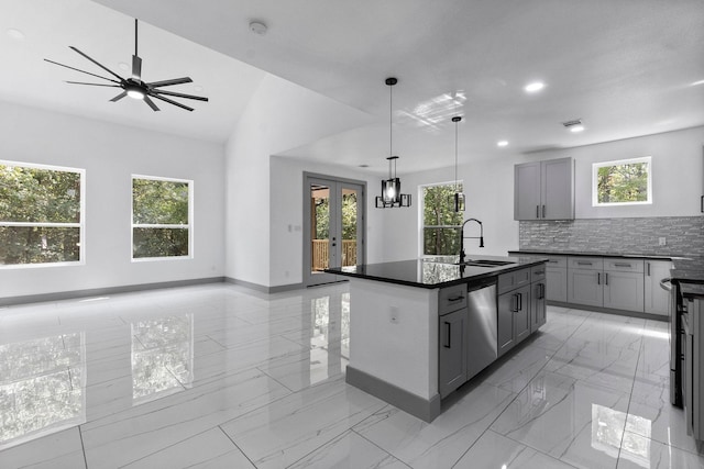 kitchen featuring pendant lighting, dishwasher, a kitchen island with sink, gray cabinetry, and french doors