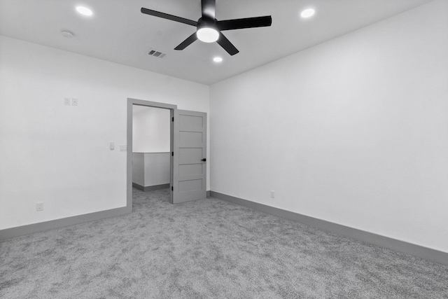 unfurnished bedroom with carpet floors and ceiling fan