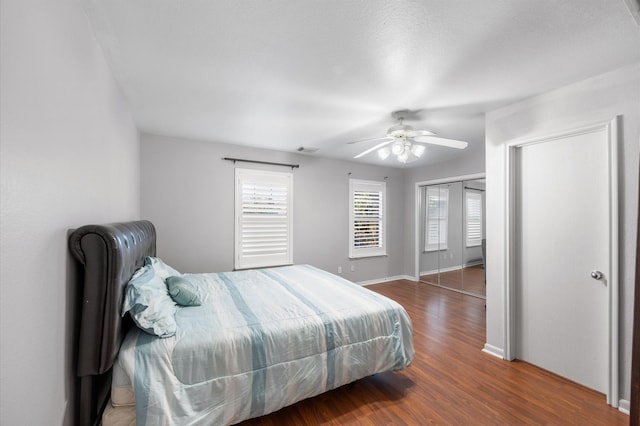 bedroom featuring ceiling fan and dark hardwood / wood-style flooring