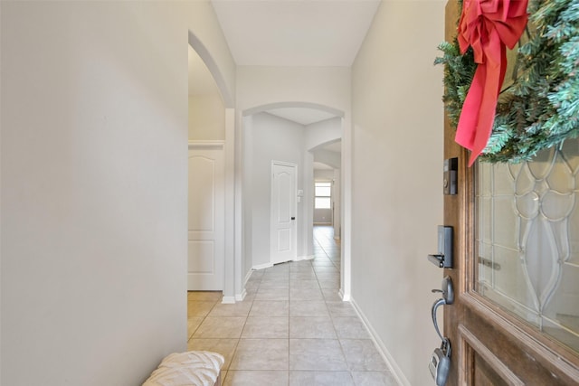 corridor with light tile patterned floors