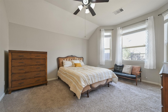 bedroom with vaulted ceiling, ceiling fan, and carpet