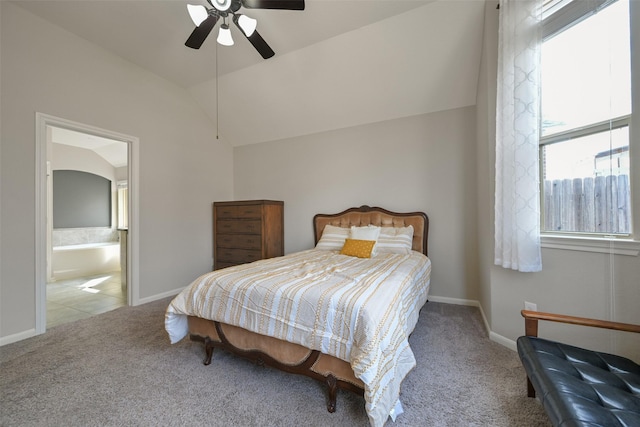 carpeted bedroom featuring vaulted ceiling, ceiling fan, and ensuite bathroom