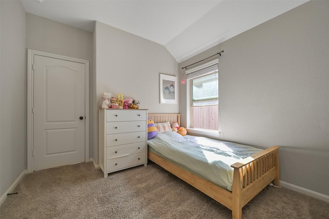 carpeted bedroom with vaulted ceiling