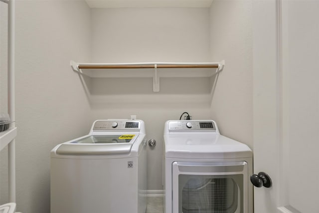 clothes washing area with independent washer and dryer