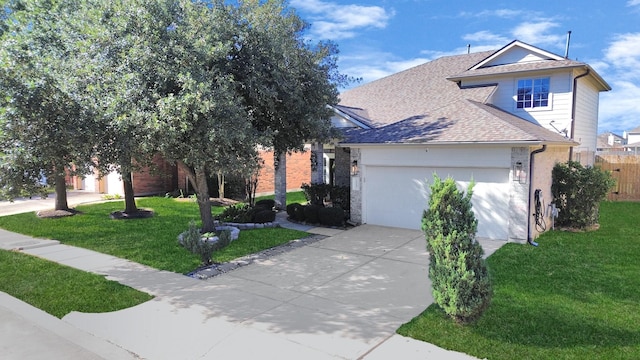 view of front of home with a garage and a front lawn