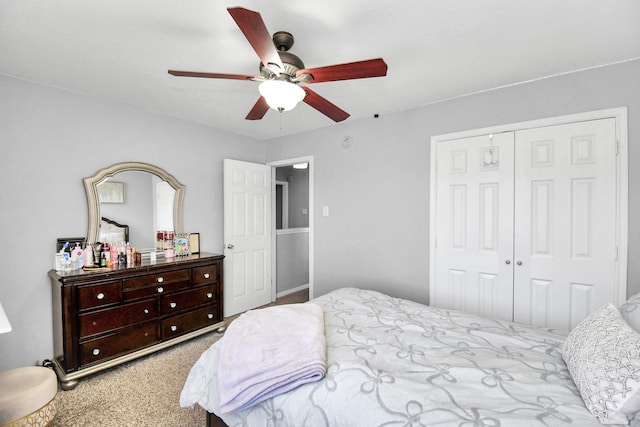 bedroom featuring light carpet, ceiling fan, and a closet