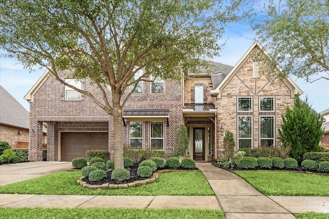 view of front property with a garage and a front lawn