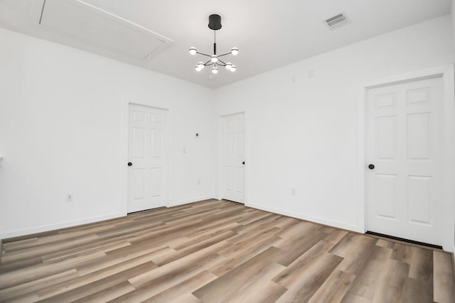 spare room with light hardwood / wood-style floors