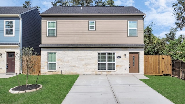 back of house featuring a yard