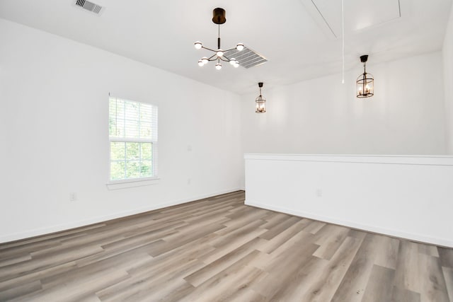 spare room featuring light hardwood / wood-style floors