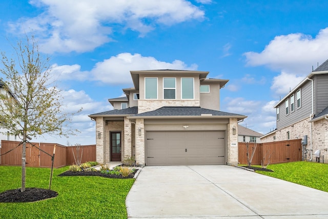 prairie-style house with a garage and a front lawn