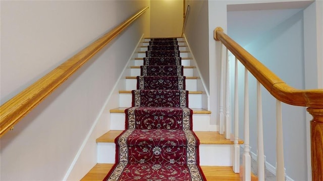 stairway featuring hardwood / wood-style floors