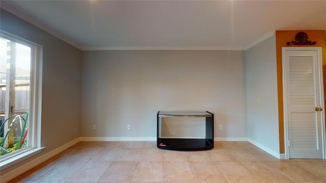 unfurnished living room featuring light tile patterned floors and ornamental molding